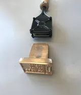 Electric ALK branding iron and an engraved brass plate