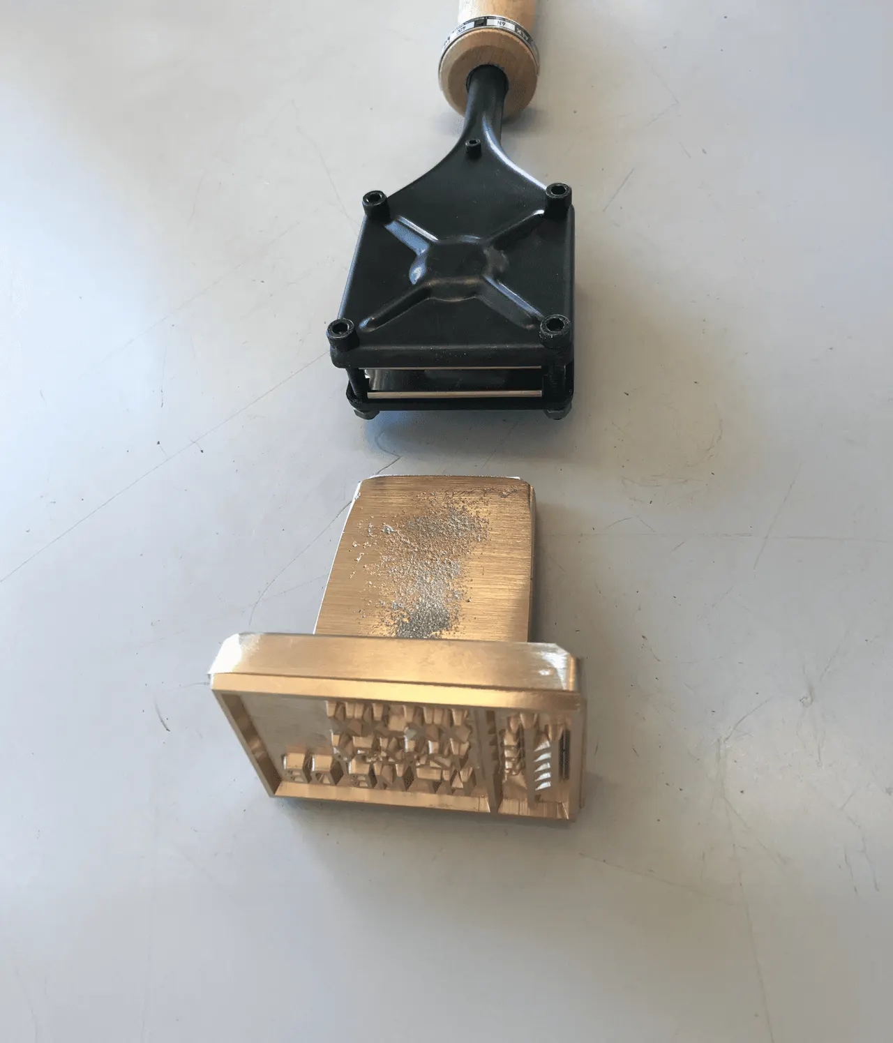 Electric ALK branding iron and an engraved brass plate